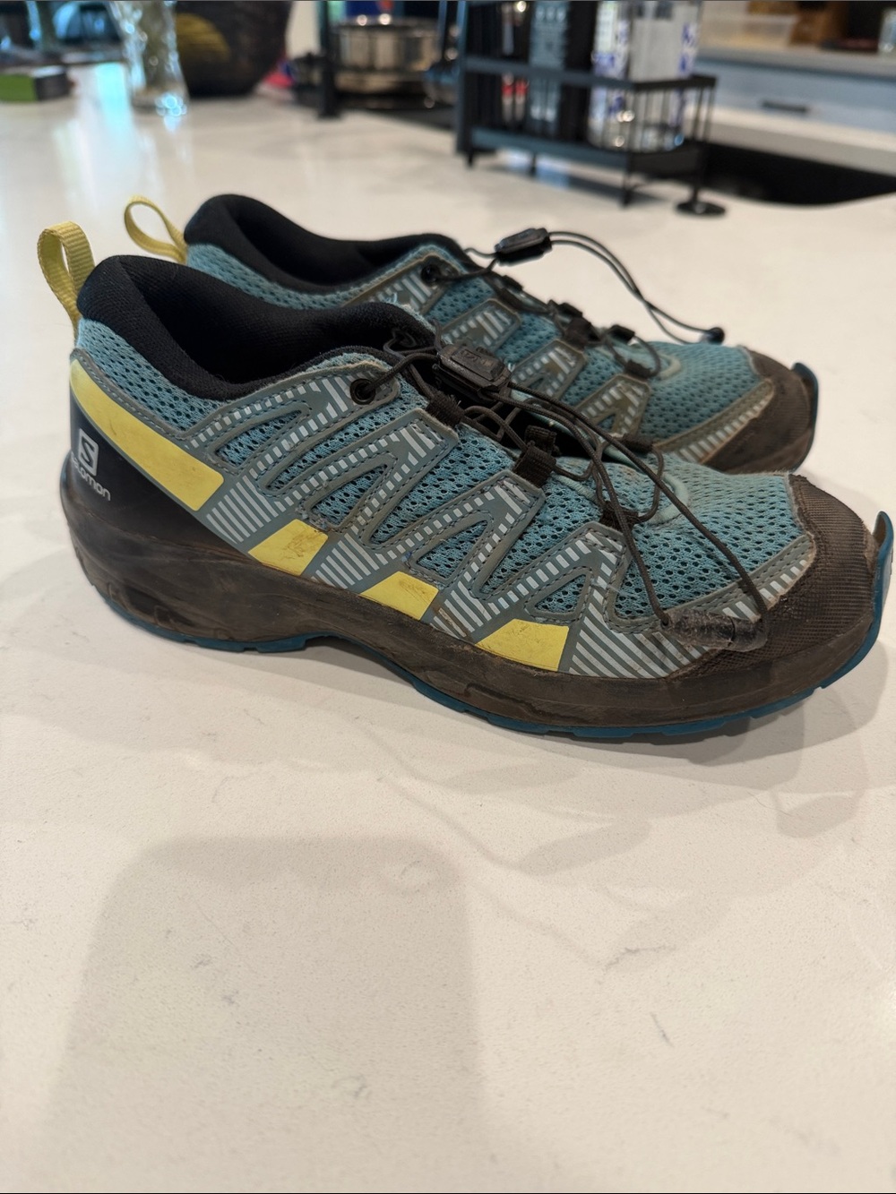 Salomon Teal Trail Running Shoes with Yellow Accents